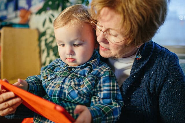 Grandmother reading to young child