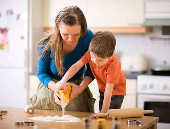 Mom baking with son.