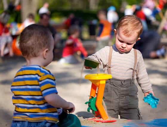 Babies playing in sandbox