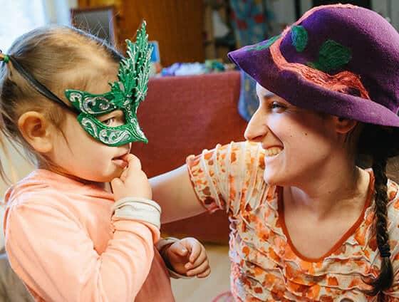 Mom and little girl play dress up